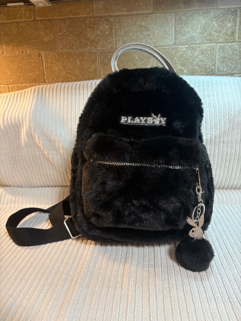 Playboy Spencer’s Exclusive Plush Black Faux-Fur Mini Backpack.